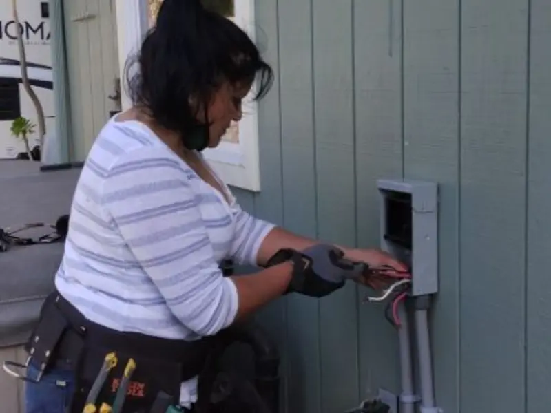 Licensed electrician wiring an exterior subpanel in North Wildwood